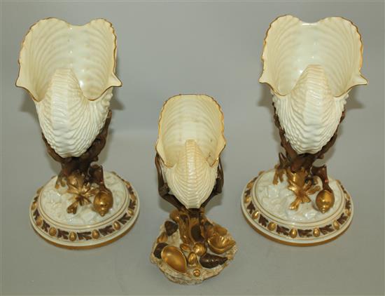 Three Royal Worcester nautilus shell vases, late 19th century, 22cm and 17.5cm